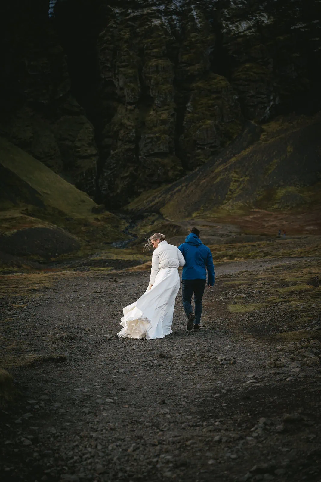 Elopement in Iceland: Newlyweds walking hand by hand