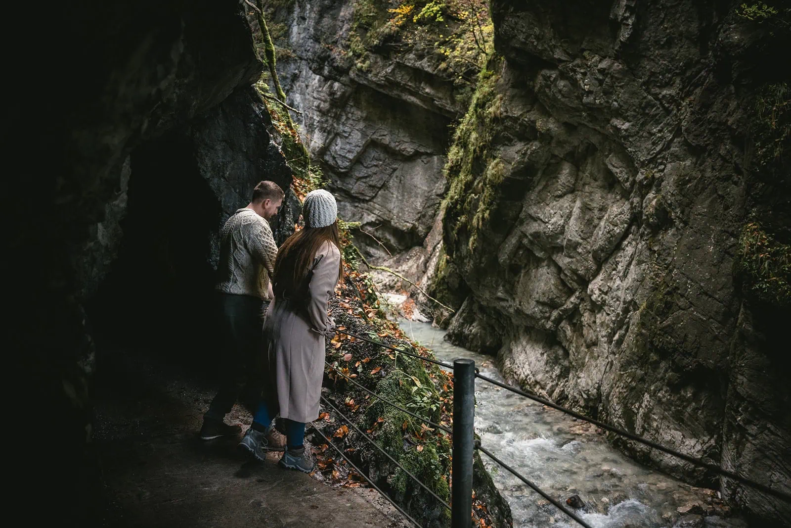 Newlyweds exploring a German cave during their elopement adventure