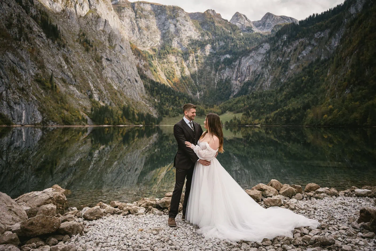 Couple pausing to take in the breathtaking views of the Bavarian lake