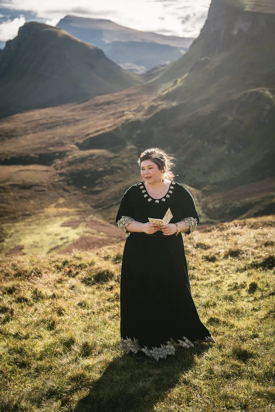 Bride with her vows, ready to read them to her groom during their Skye elopement ceremony