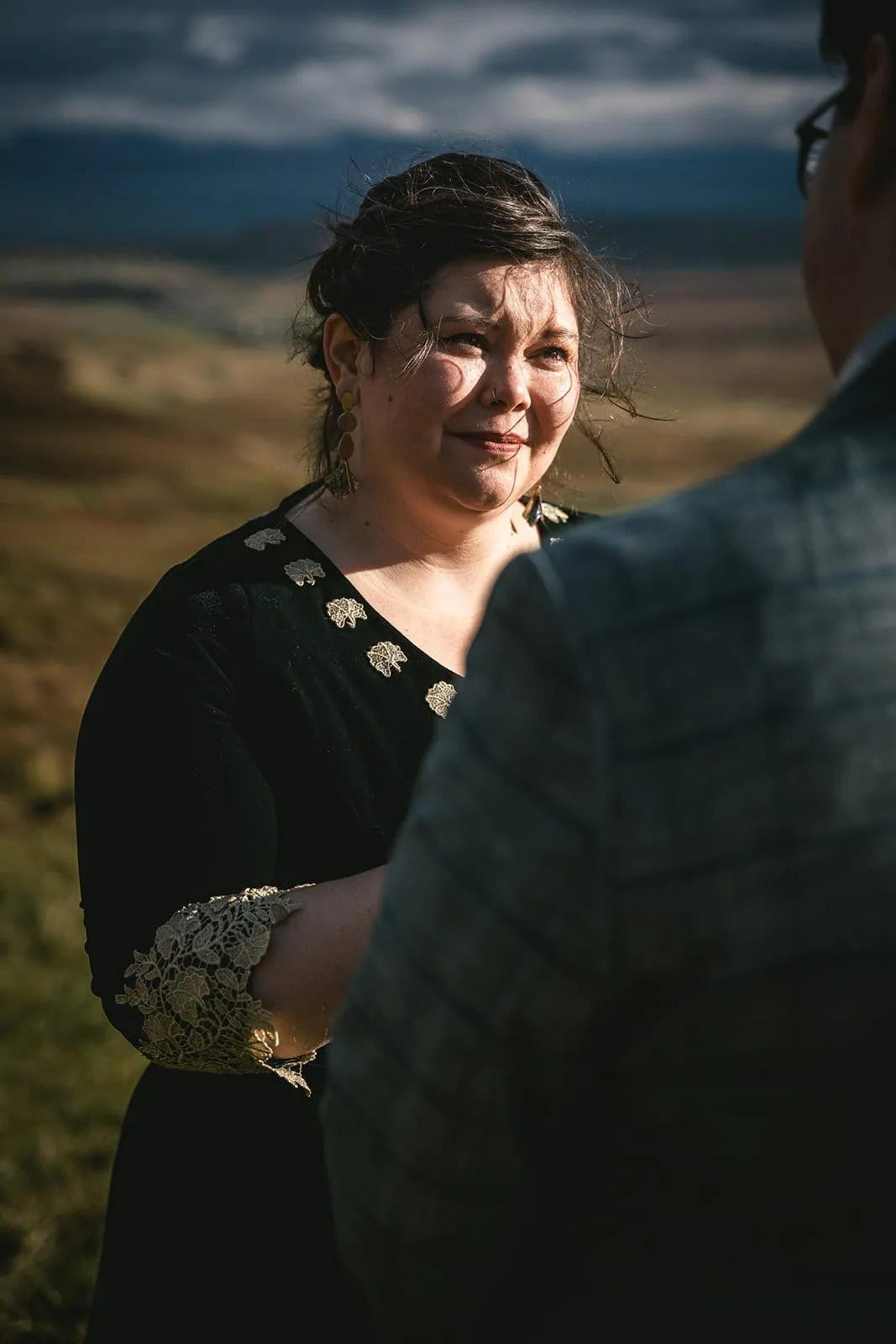 Bride smiling while reading her vows during her Skye elopement ceremony