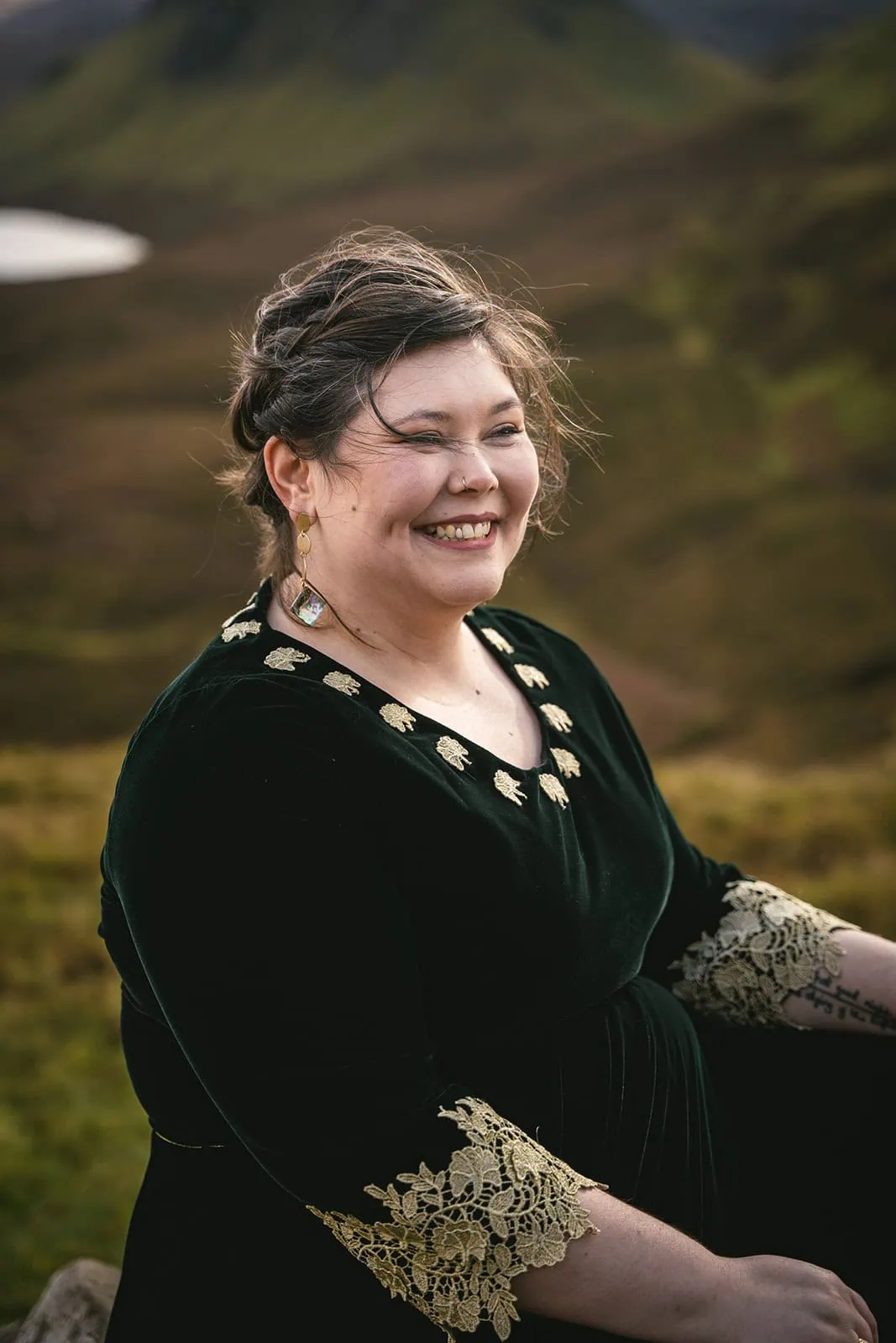 Bride gazing at the Scottish highlands, a dreamy backdrop for their Skye elopement