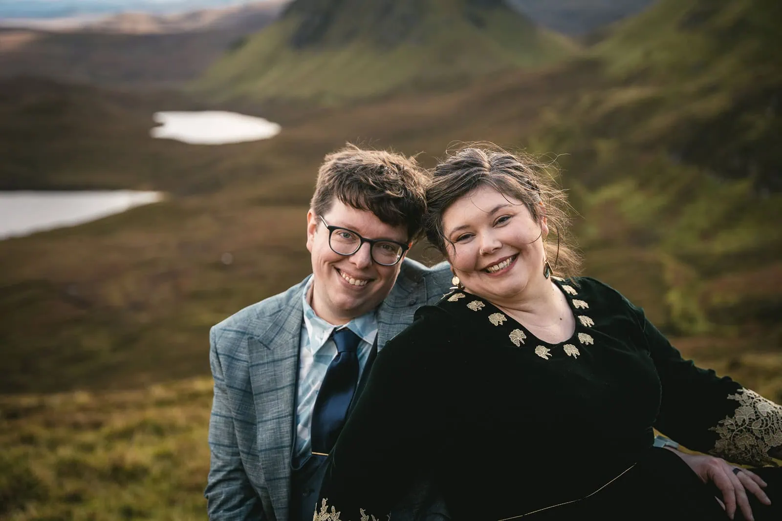 Newlyweds laughing together during their mountain photo shoot
