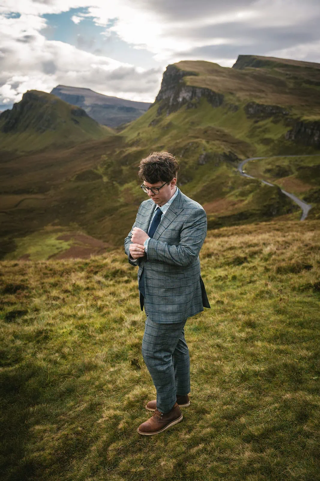 Skye elopement: Portrait of the groom on a Scotland hilltop
