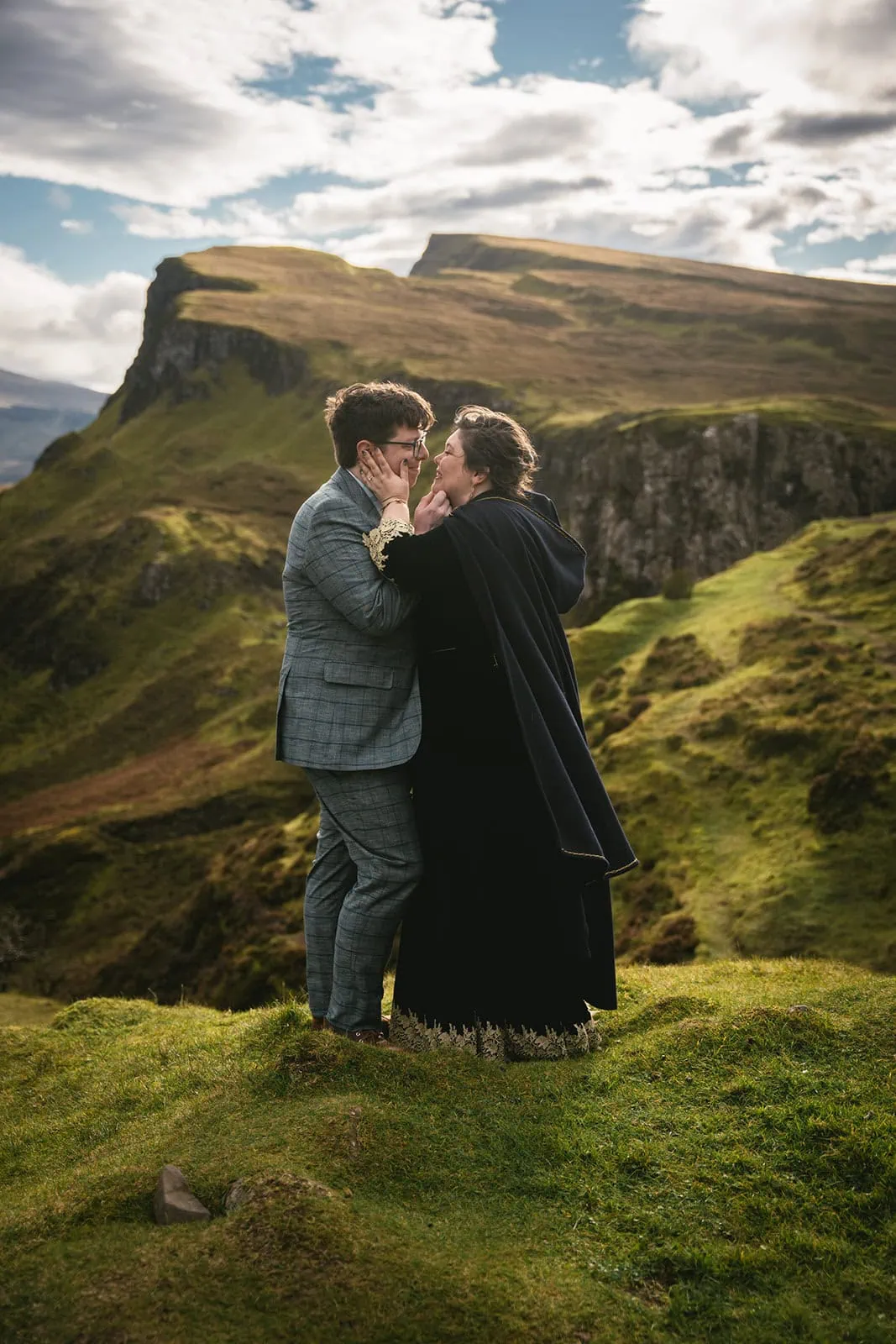 Newlyweds sharing a tender moment during their Scotland elopement in the Isle of Skye