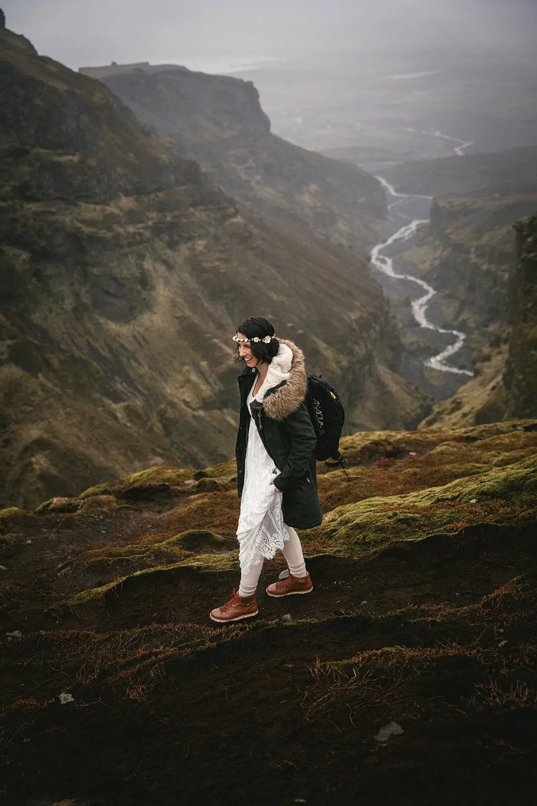 Bride walking toward the canyon during her Iceland elopement