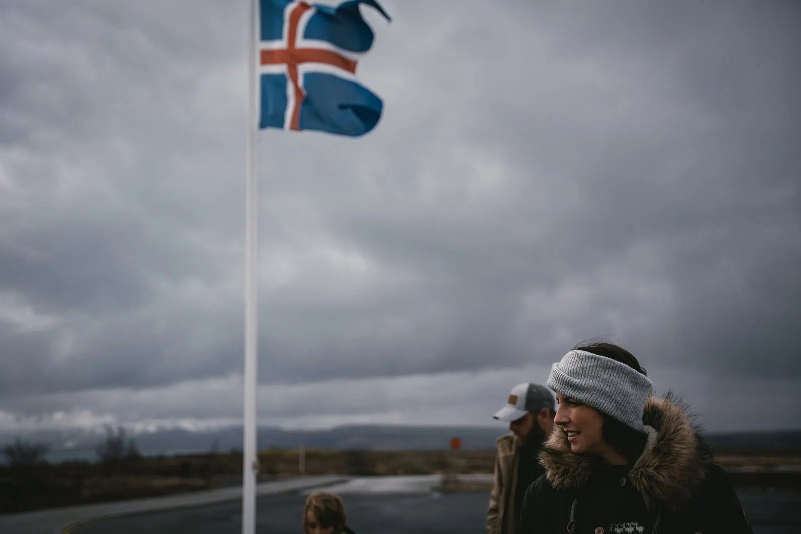 Bride and the Icelandic flag during her Mulafjulfur elopement