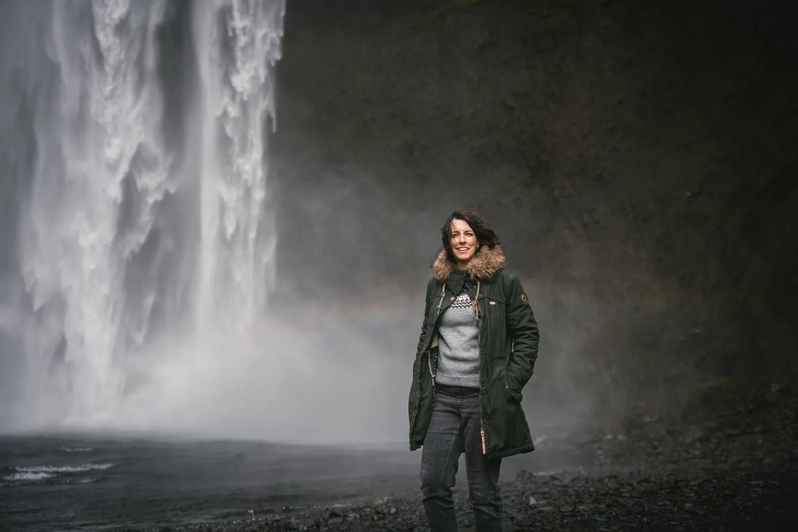 Portrait of the bride against a scenic waterfall backdrop during the Mulafjulfur elopement