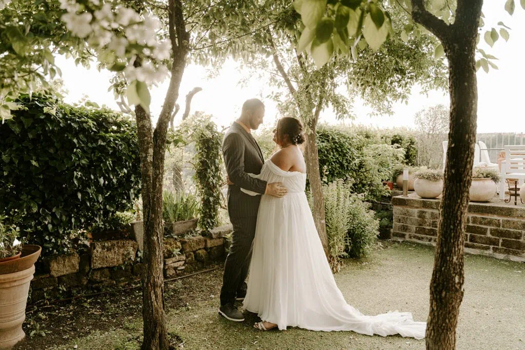 Rome elopement newlyweds standing on a balcony overlooking the countryside