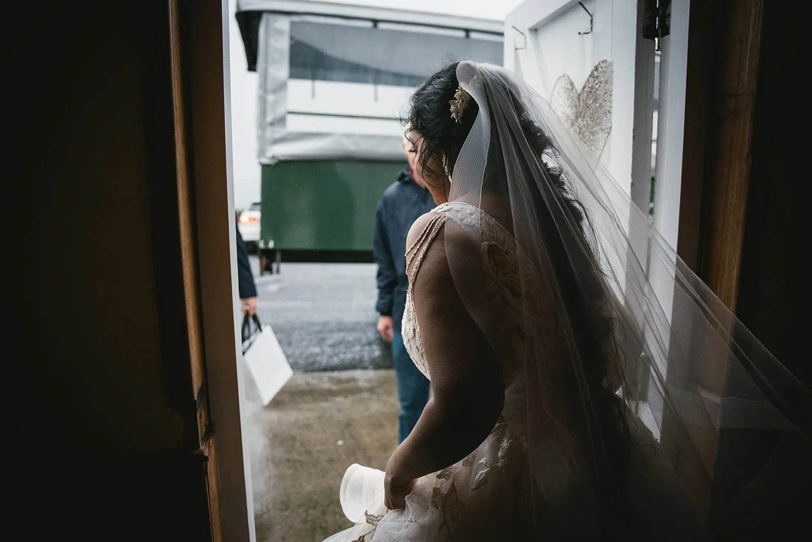 Bride getting ready for a tractor ride during her Dunluce Castle elopement