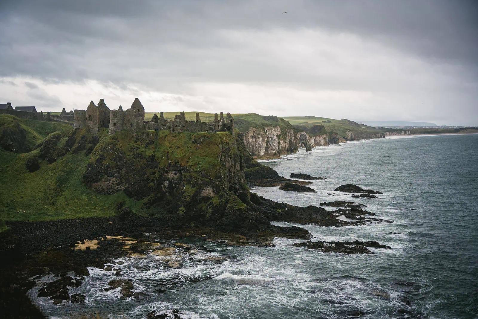 The castle ruins at Dunluce serve as a dramatic backdrop for the elopement