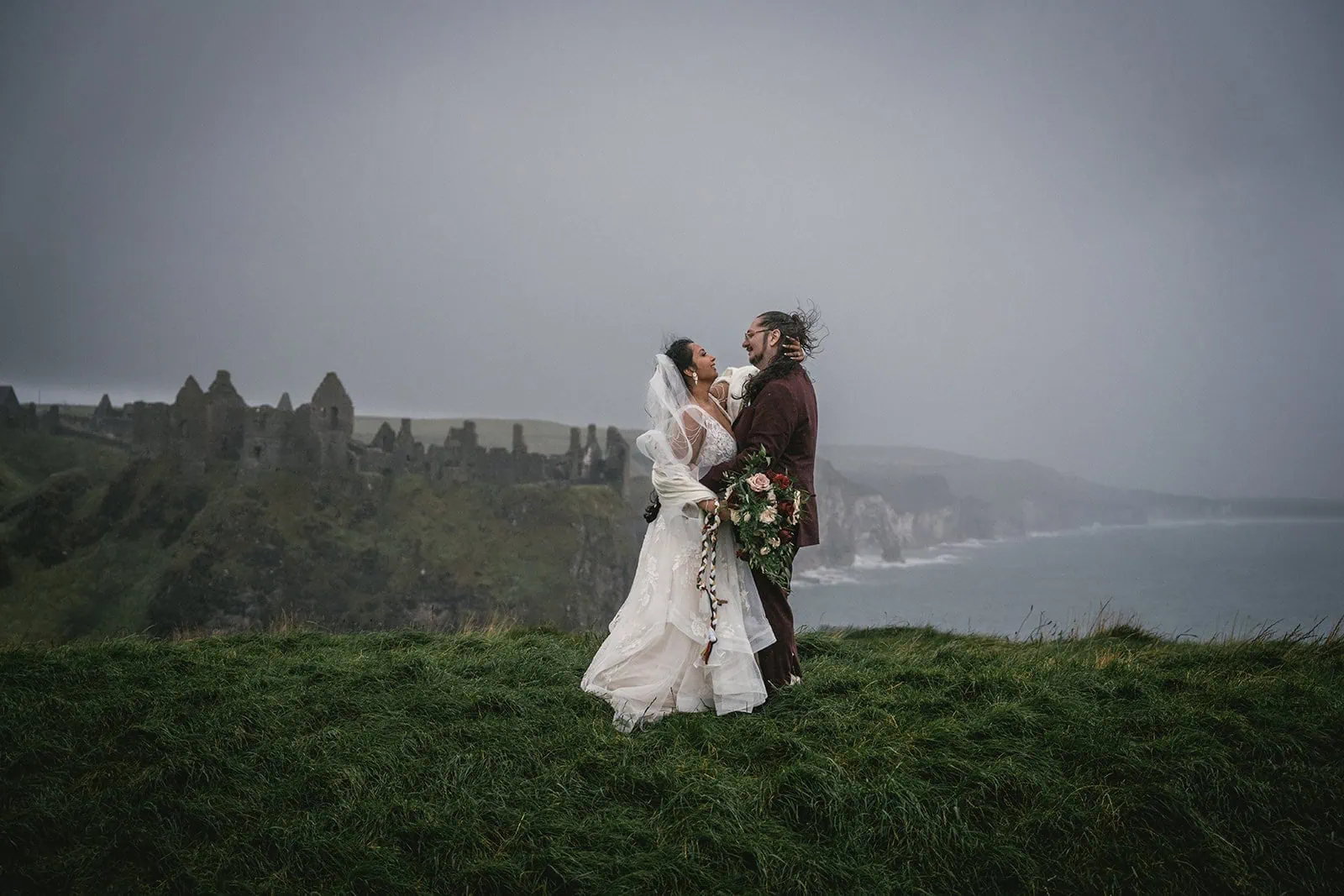 The moment before the kiss at Dunluce Castle elopement