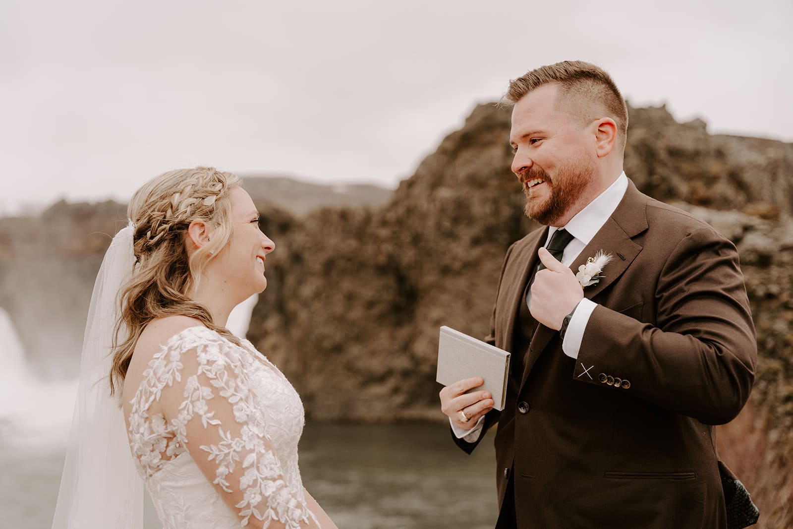 Adventure elopement in Iceland featuring a ceremony by a breathtaking waterfall