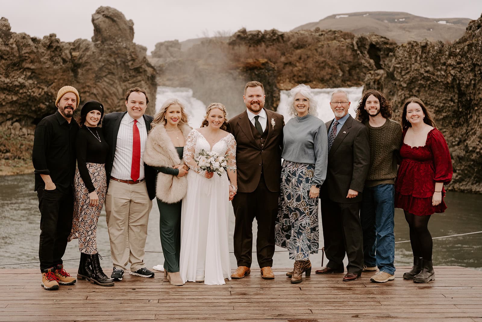 The couple celebrating their Iceland waterfall elopement with their guests