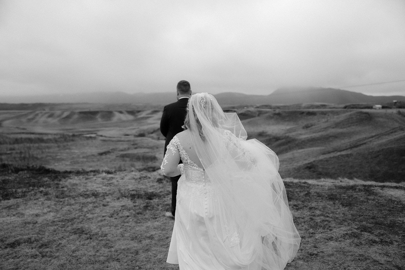 Bride walking toward her groom for the first look during their Iceland elopement