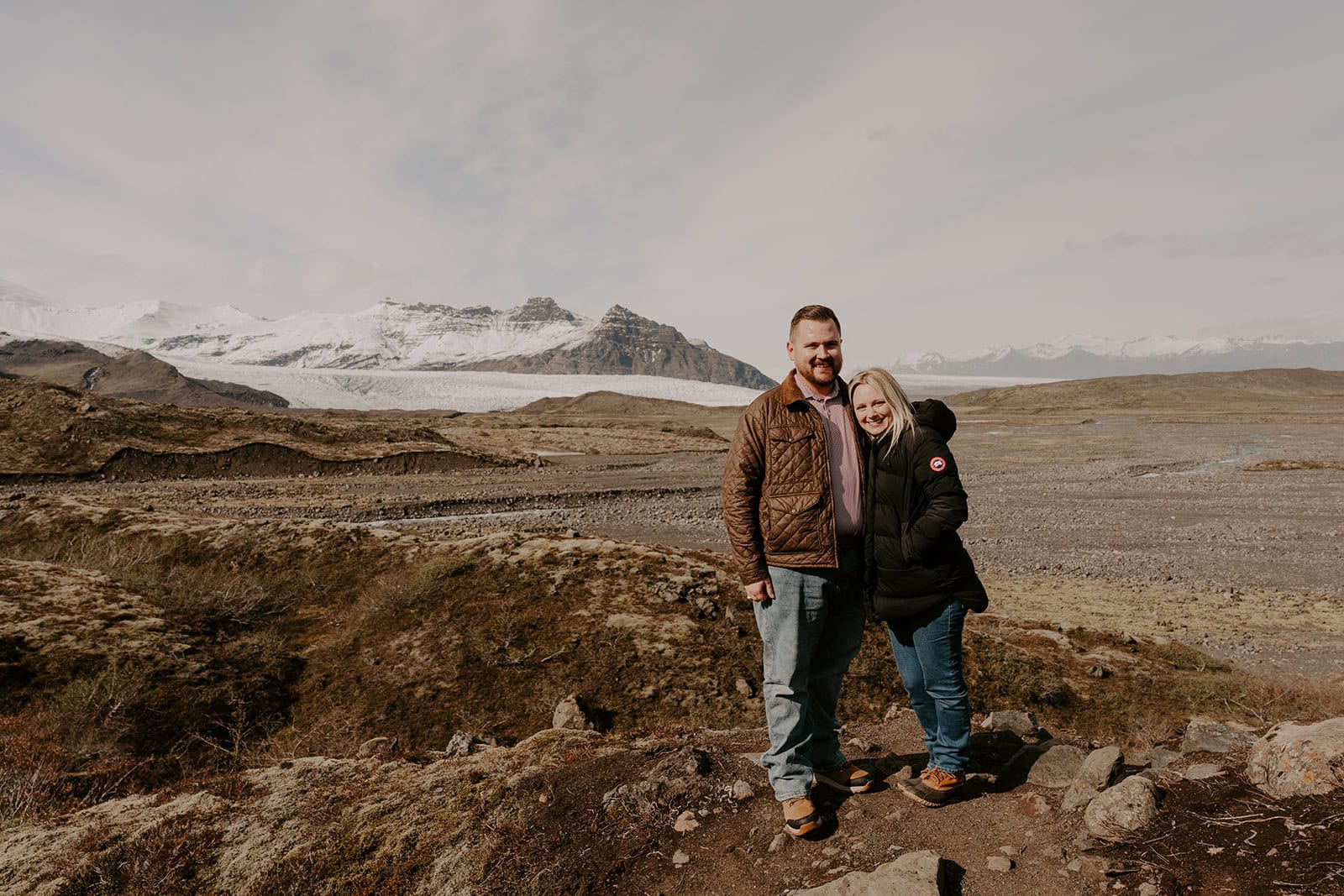 The couple exploring Iceland’s dramatic landscape during their adventure elopement