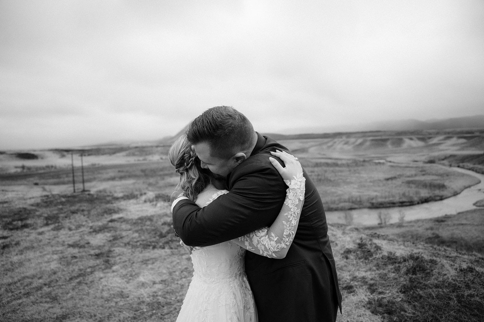 Couple holding each other after the first look in a moment of reflection during their Iceland elopement