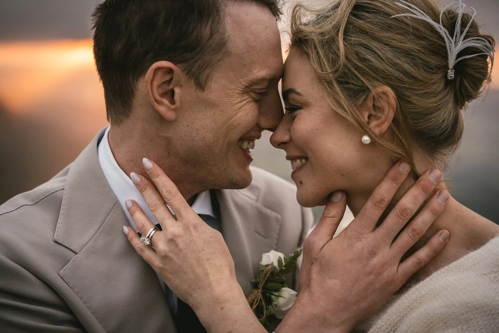 Intimate portrait of the couple on a cliffside at sunset during their Asturias elopement