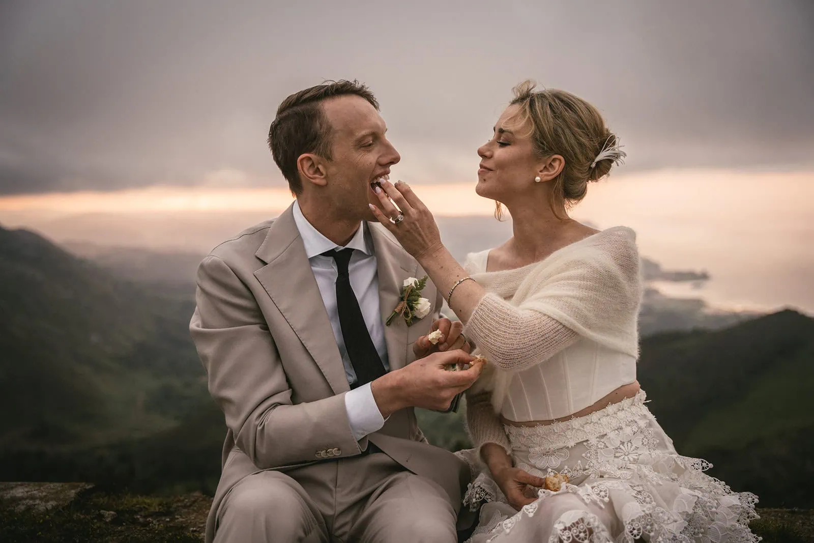 Couple standing on a peak with views of Asturias’ unique landscapes, enjoying their picnic