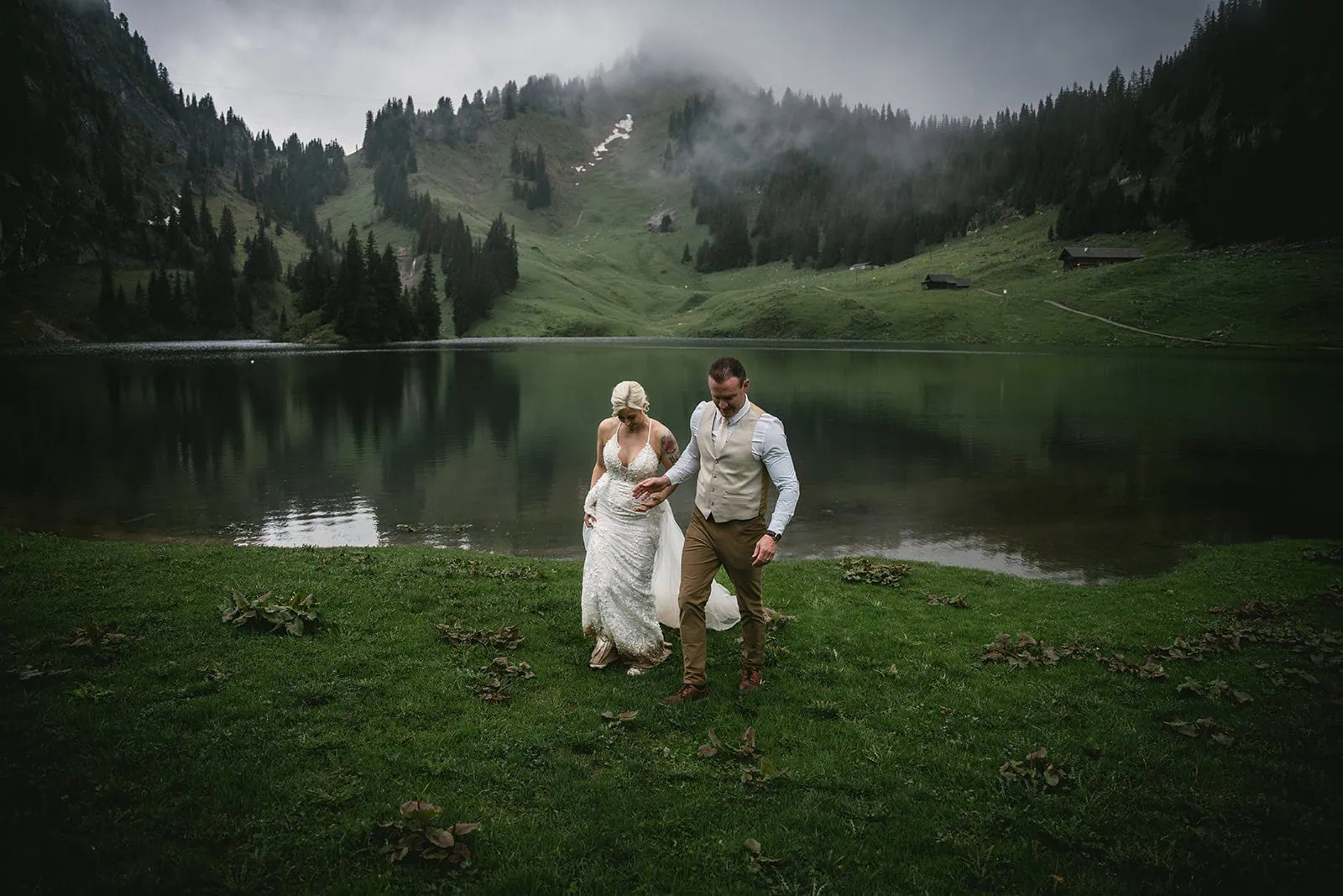 A candid moment by the lake after the Switzerland elopement ceremony