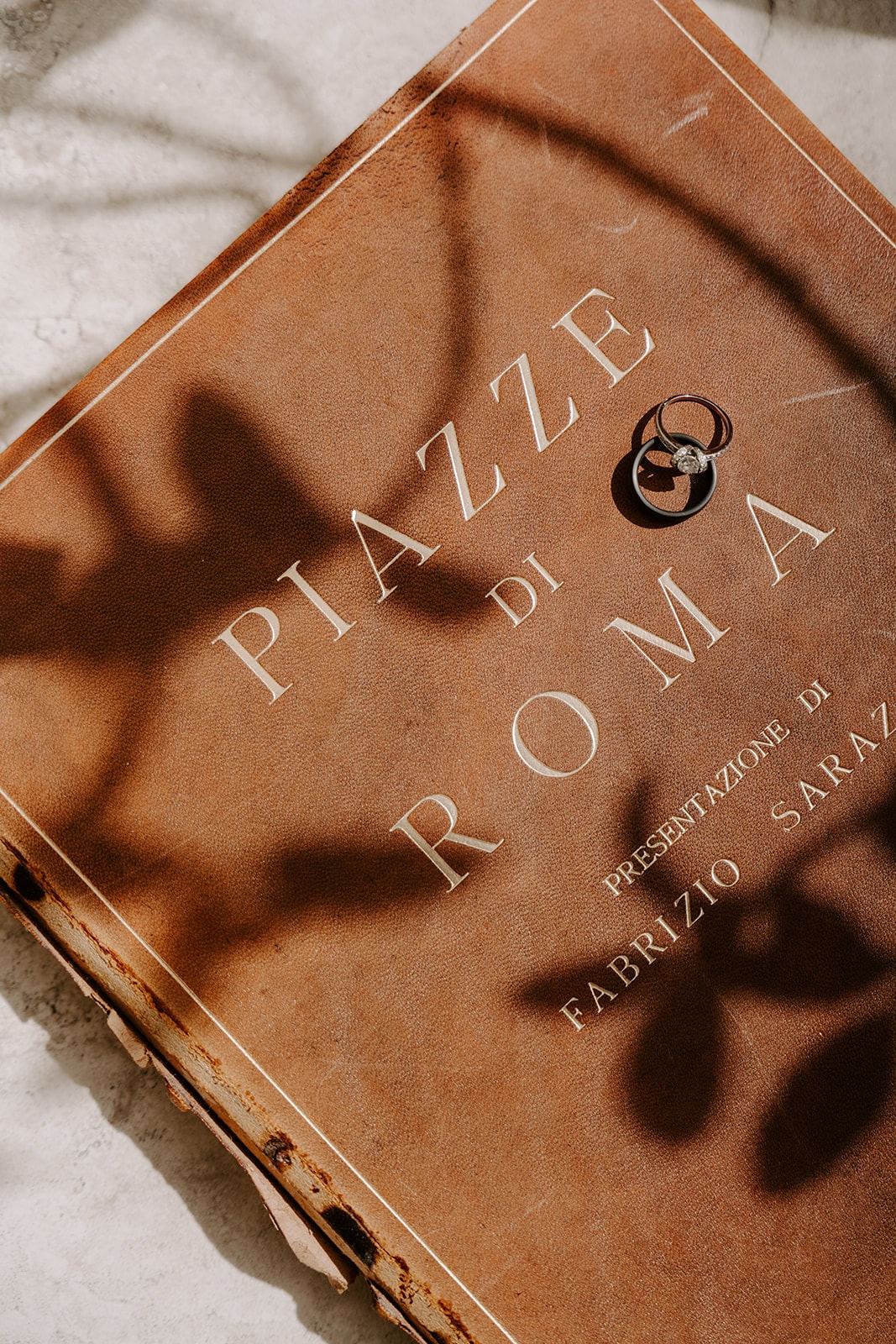 Detzail of the wedding ring on a menu during an Italian elopement