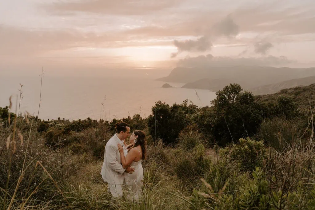 The couple sharing an embrace with a view during their Cinque Terre elopement