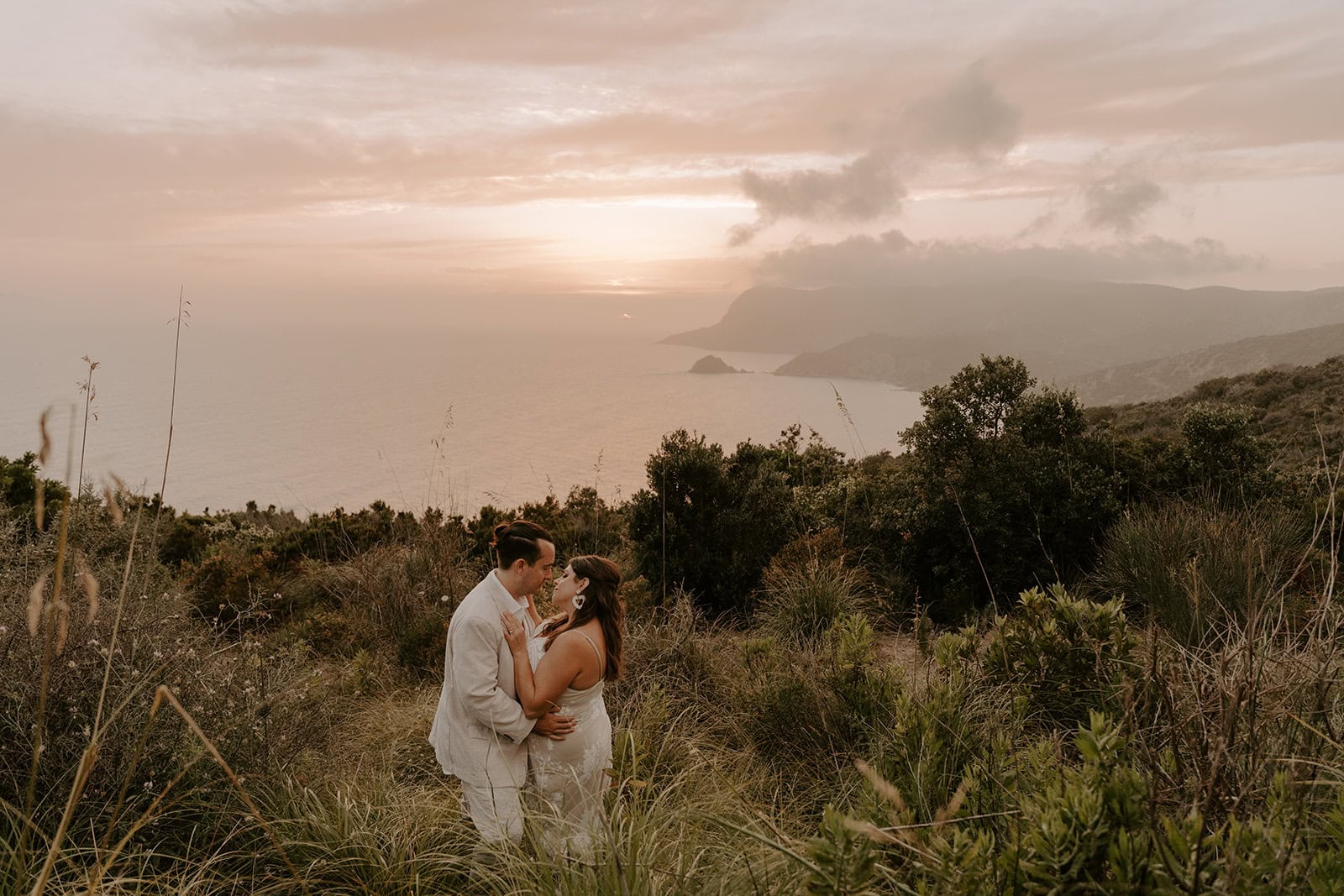 The couple sharing an embrace with a view during their Cinque Terre elopement