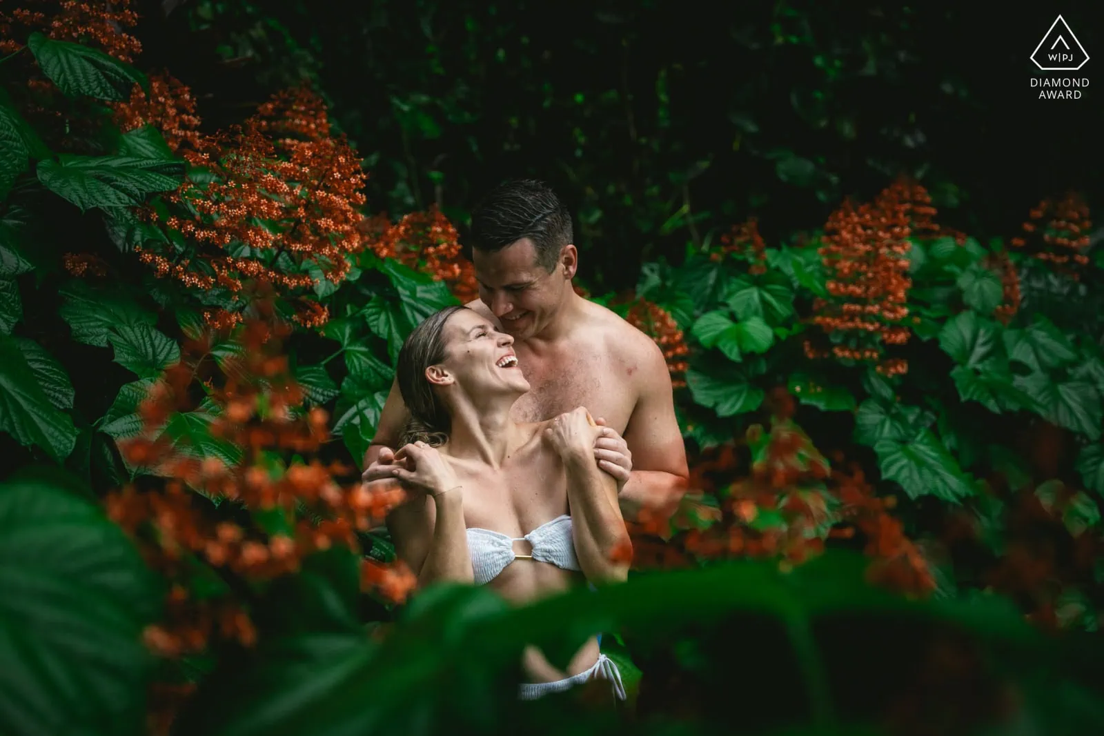 Couple celebrating in stunning Azorean landscape, highlighting why couples choose our elopement packages in the Azores