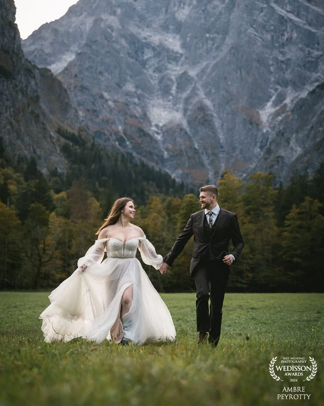 Joyful couple running through New Zealand's mountain landscape, capturing the adventurous spirit of our 10-hour Hobbit's Journey elopement package in Middle Earth