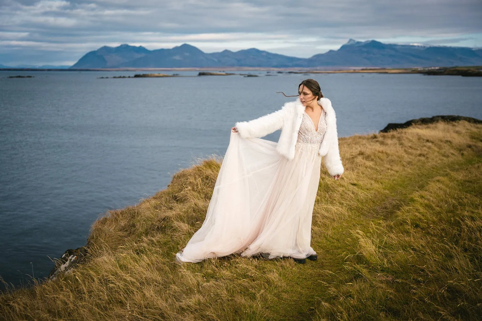 Bride twirling in her wedding dress during this Reykjavik elopement photoshoot