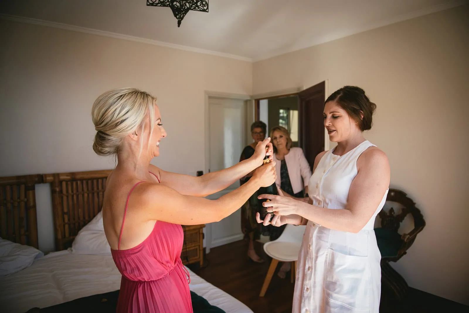 Birde and witnesses celebrating a South of France elopement with champagne