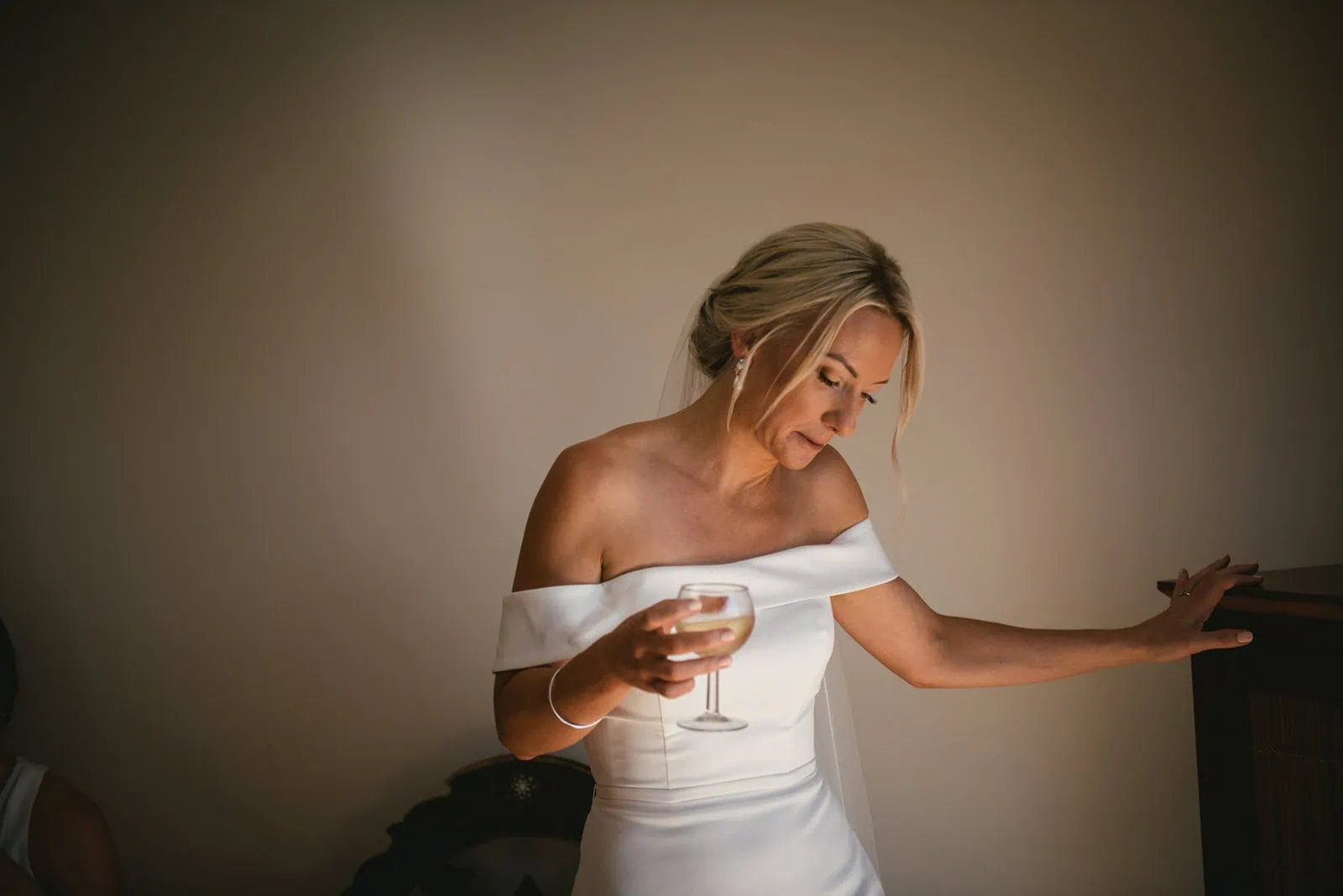 The bride sharing a toast with champagne during her South of France elopement