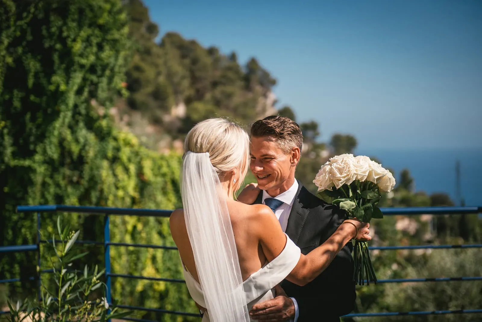 Groom smiling as he sees his bride for the first time at their South of France elopement