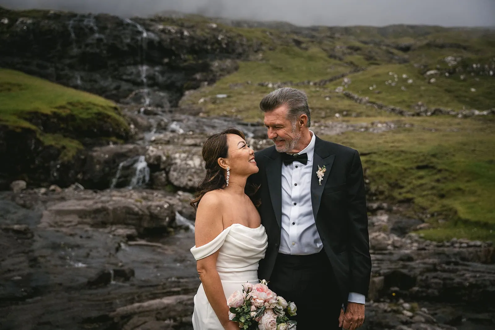 Bride and groom gazing at each other, an intimate moment during their Torshavn elopement
