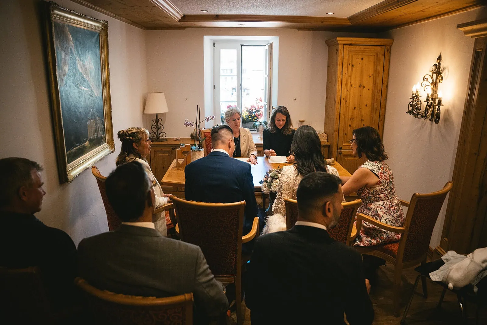 Bride, groom and their guests at the town hall during a Zermatt elopement