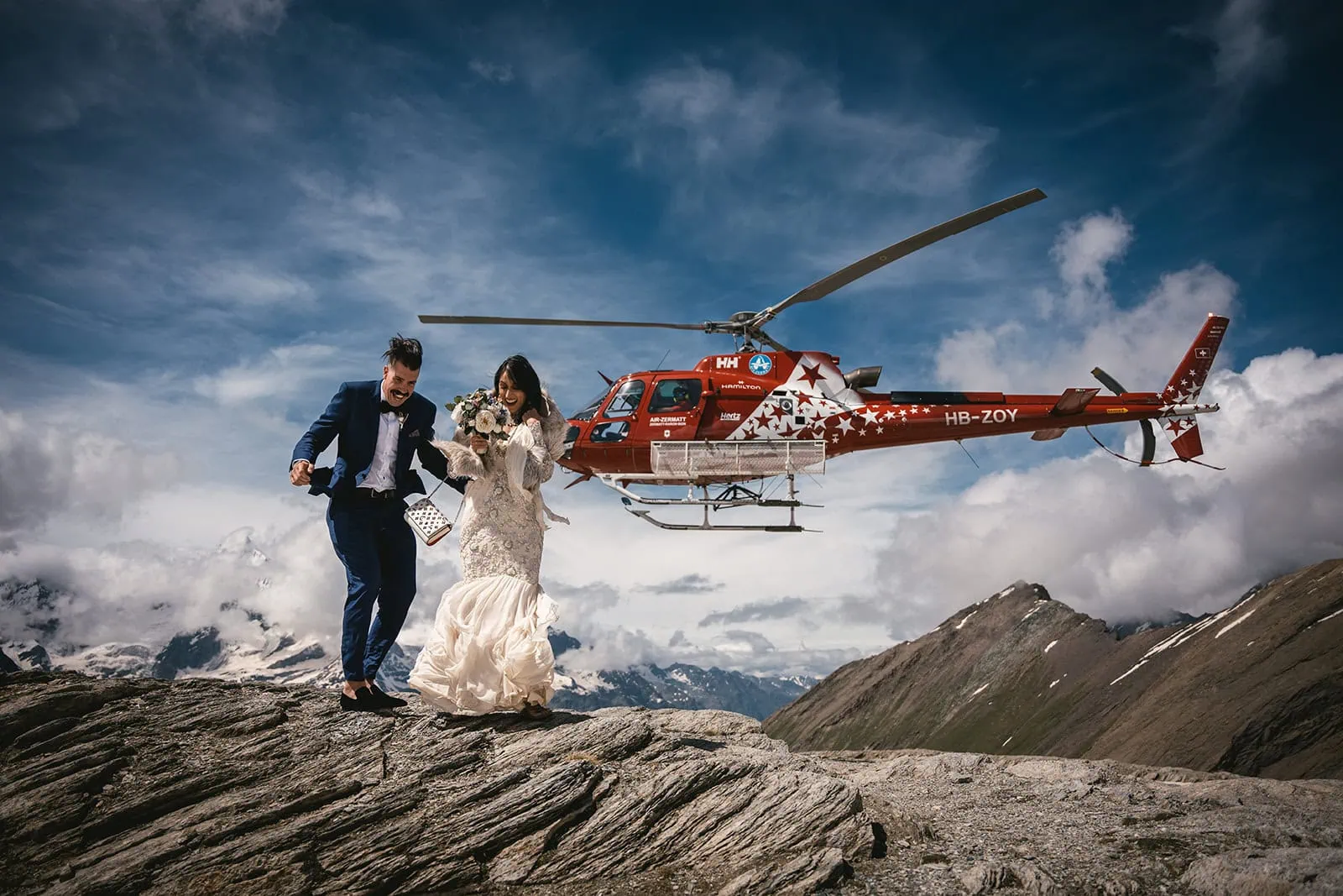 The helicopter leaving the bride and groom at the top of the mountain for an intimate Zermatt elopement