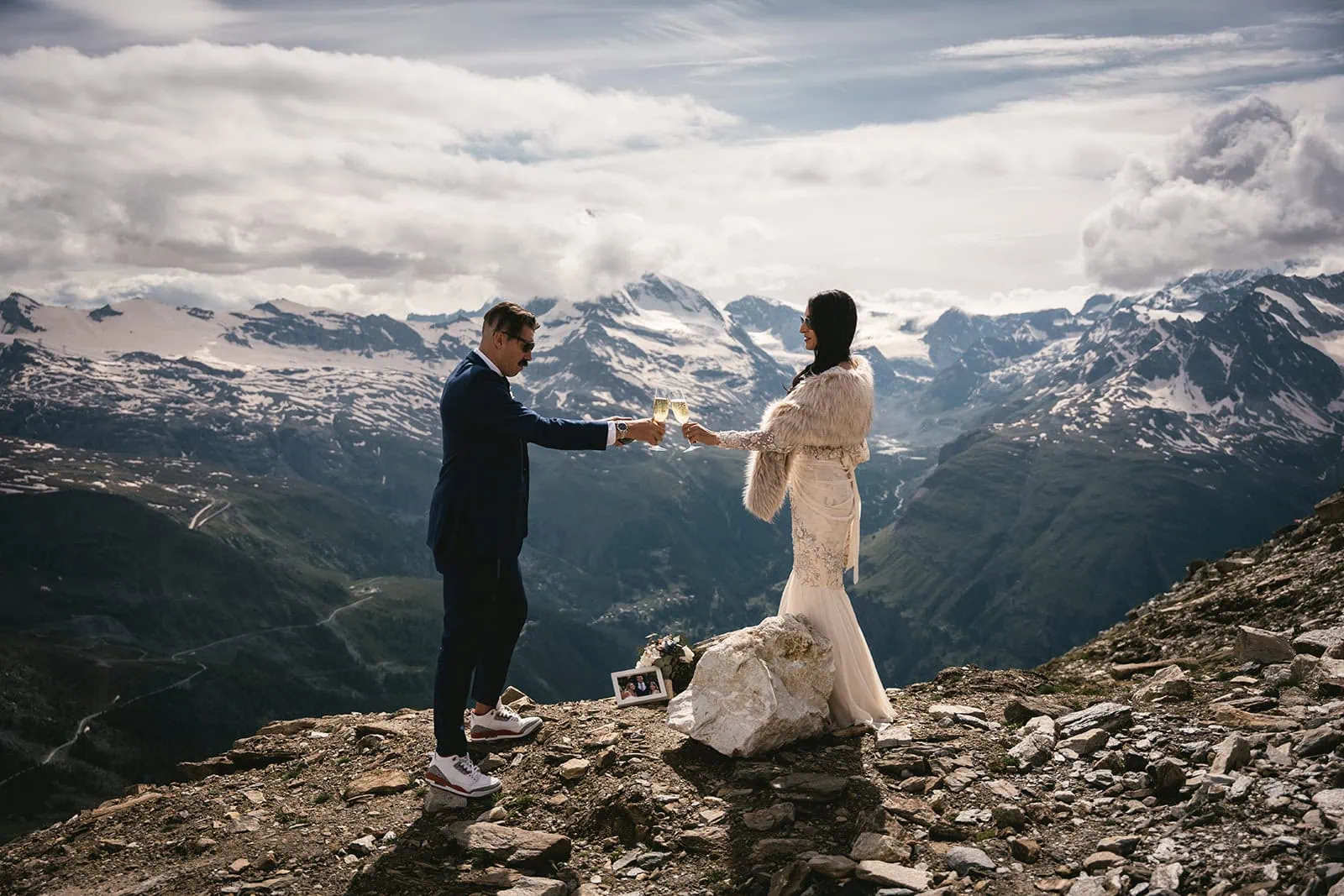 The couple celebrating their love with a romantic toast during their Zermatt elopement