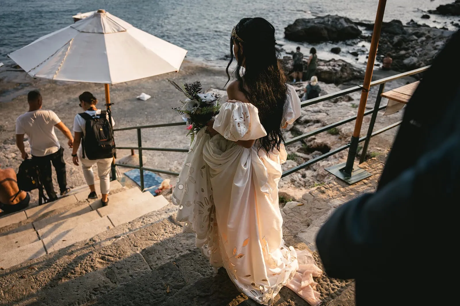 Bride walking down the steps to the beach for a last Dubrovnik elopement shooting