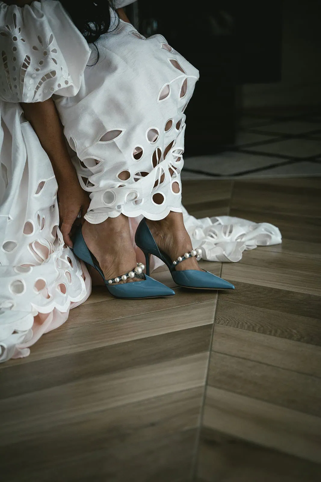 Detail of the bride putting on her shoes for her Dubrovnik elopement