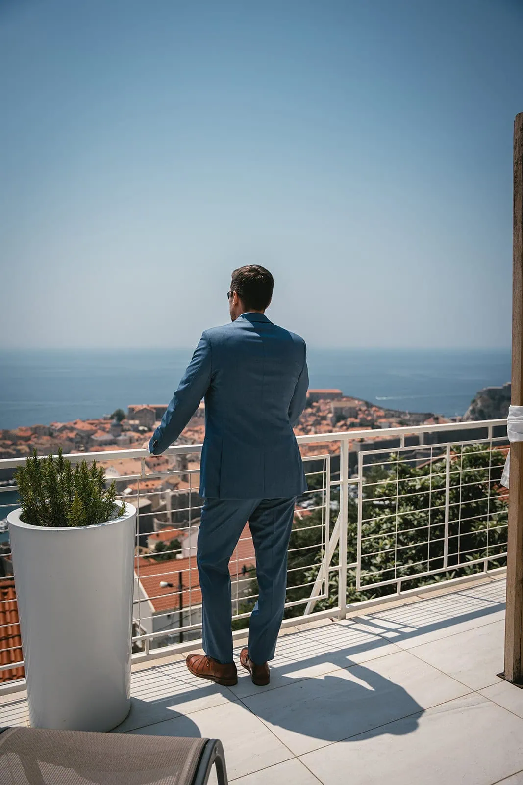 Groom looking a the sea, waiting his bride for their first look in a Dubrovnik elopement