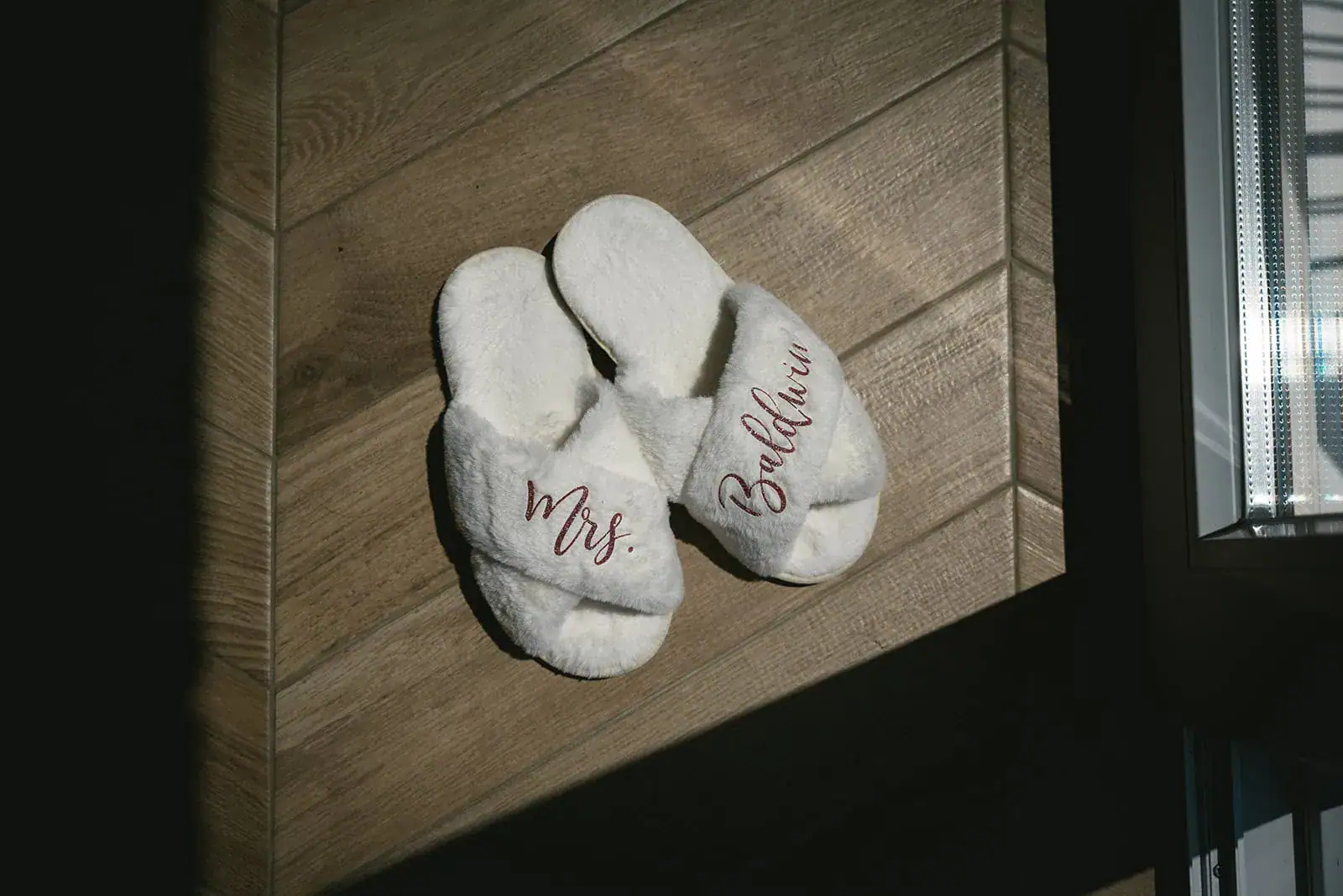 The bride's slippers with her new last name during her Dubrovnik elopement