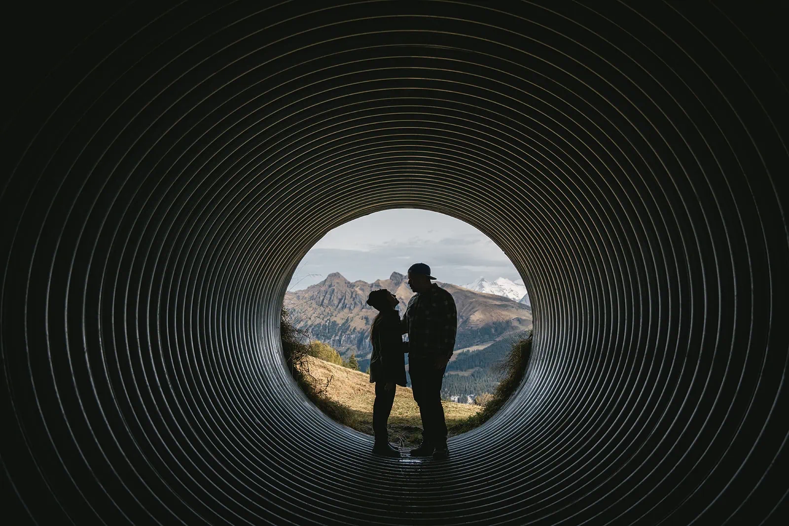 Silhouette of the couple framed by a tunnel in their Gornergrat elopement