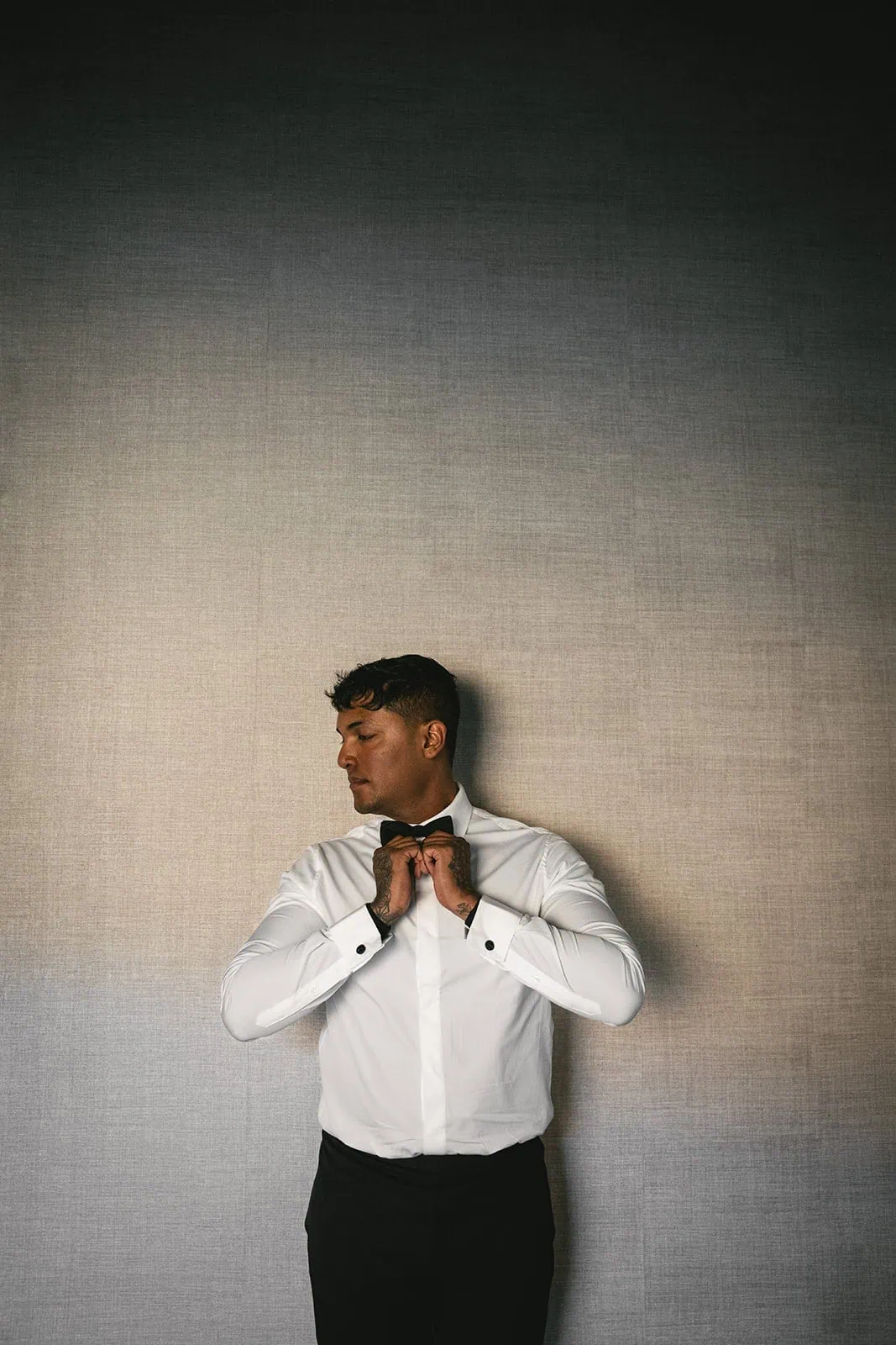 Portrait of the groom as he's getting ready for his Hofn elopement