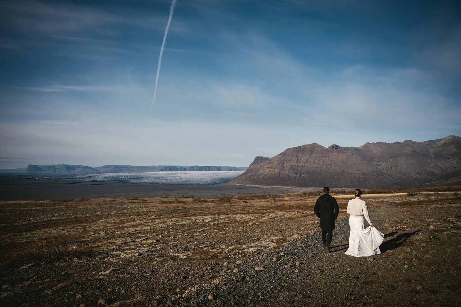 The couple looking out over the fjords near Hofn during their elopement week