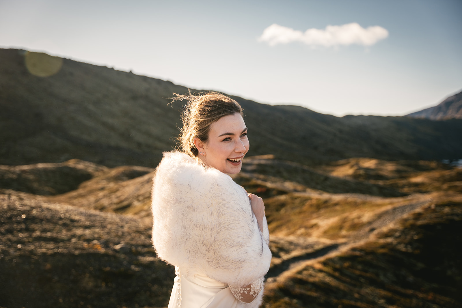 Portrait of the bride, enjoying a hike in her Hofn elopement