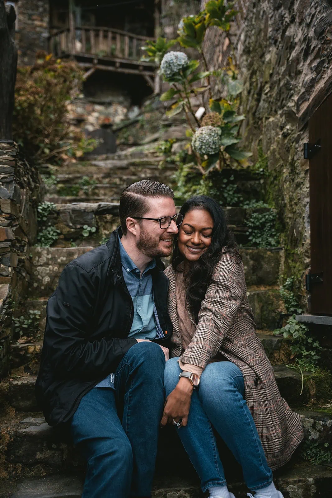A tender moment as the bride and groom exploring Portuguese stone house during their Lisbon elopement