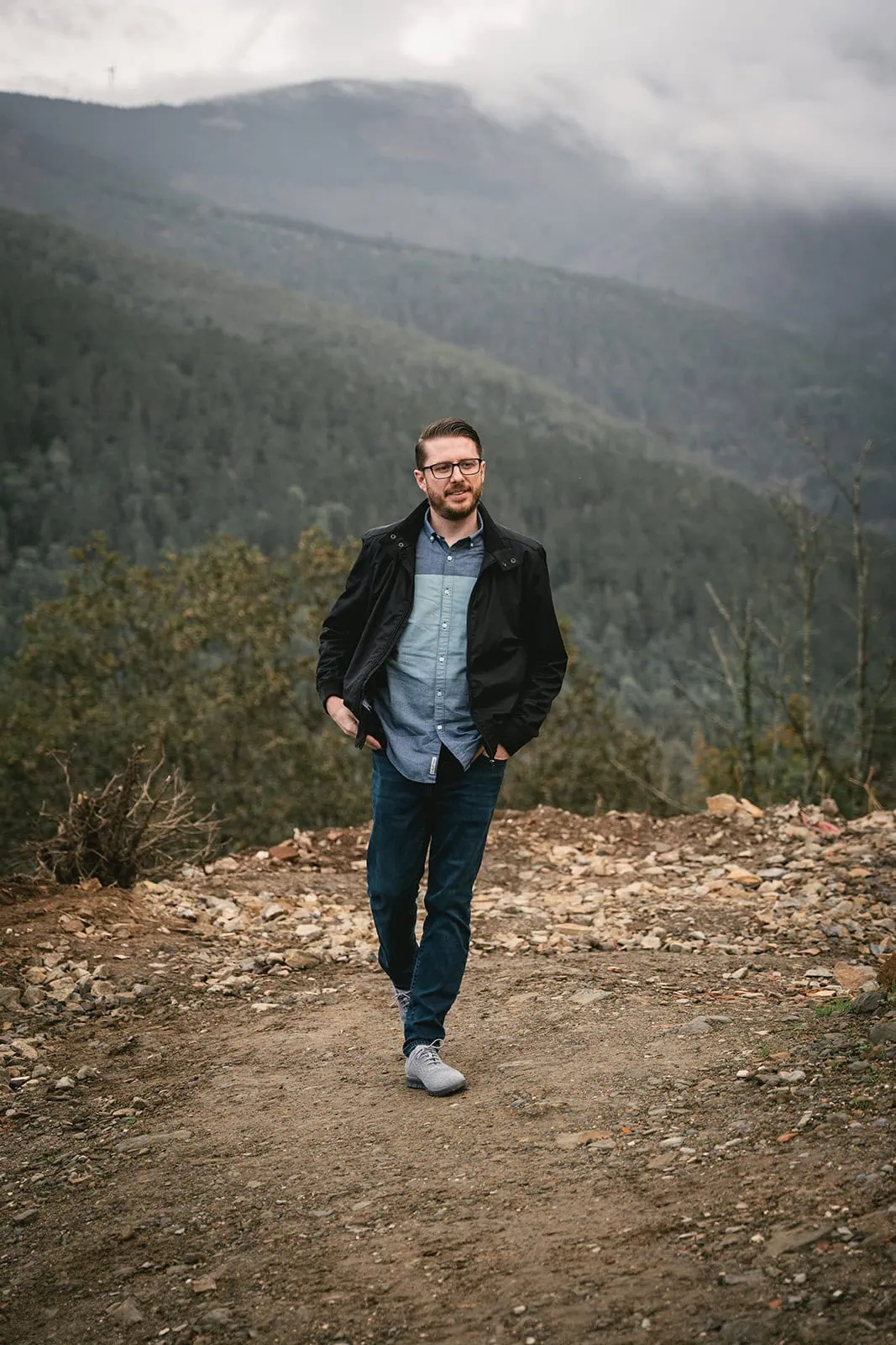 Groom exploring a hidden path in nature during his Lisbon elopement