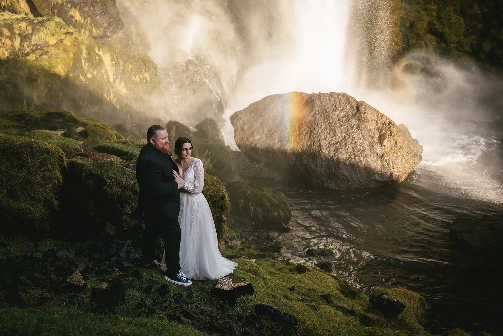 Stunning shoot beside a waterfall surrounded by moss and magic in their Vik elopement