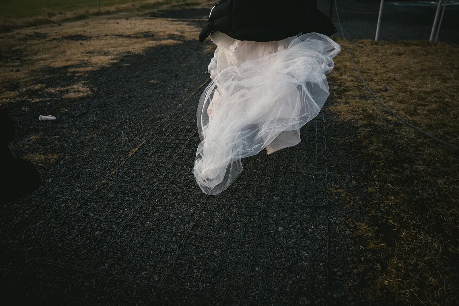The bride's dress on an Icelandic natural path in her Vik elopement