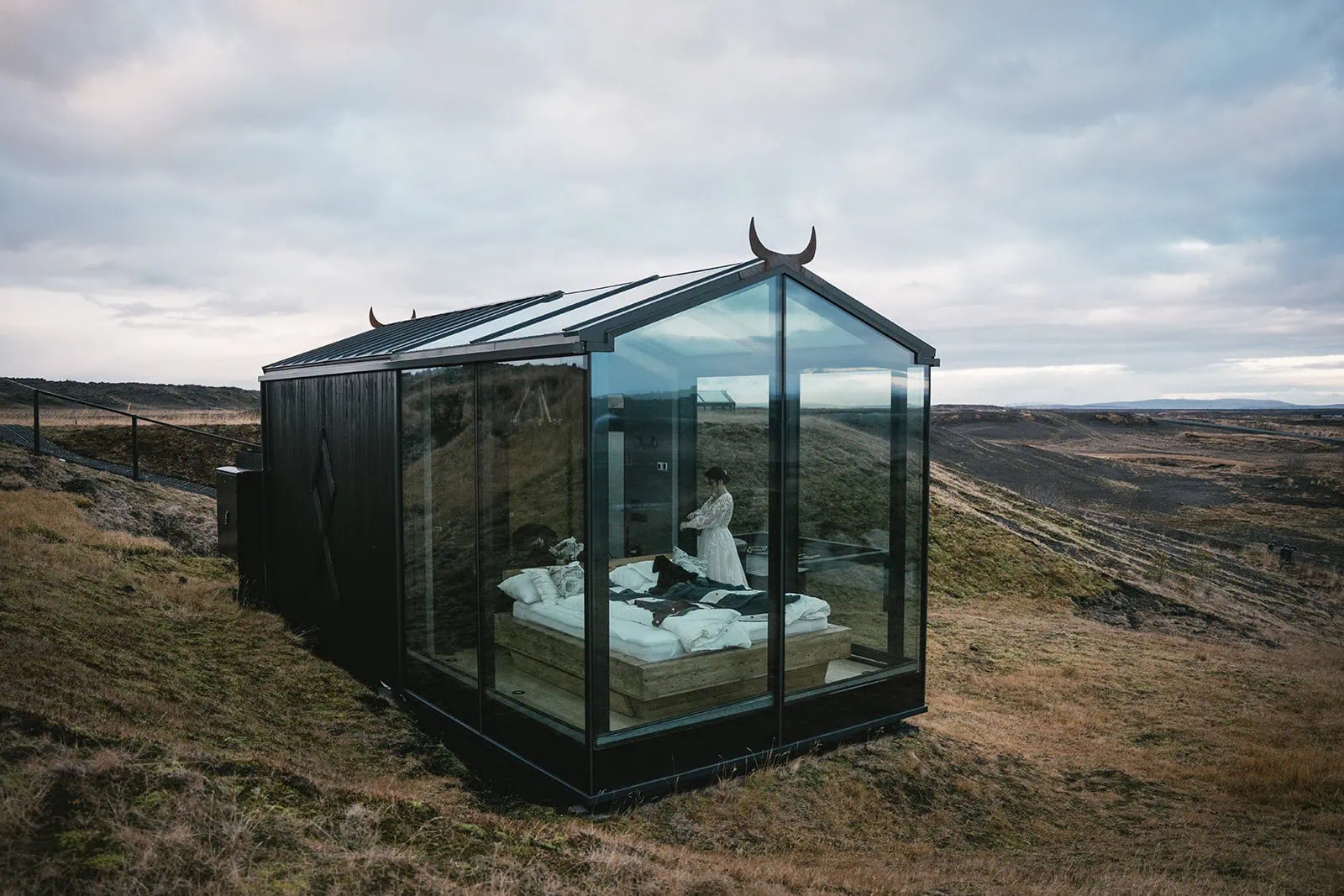 Atmospheric getting ready photos before heading out for their Vik elopement